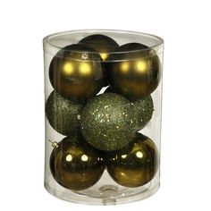 gold and green ornaments in a clear container