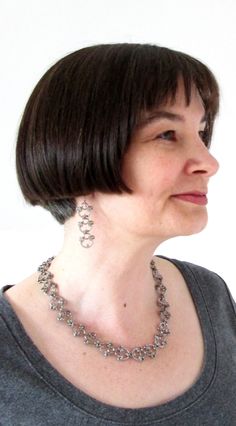 What to wear with your new tattoo: these long dangle earrings will add a touch of intricate modern chainmaille to your evening or everyday outfit. They may look delicate, but these steel and titanium designs are strong enough to stand up to the challenges of everyday life. (Just like you.) Wear them for that presentation where you could use a little more armor, the wedding toast you've been practicing for days -- or the private celebration after you've accomplished all that, and more. Industrial Feminine, Long Black Gown, Wedding Toast, Edgy Accessories, Lotus Earrings, Wedding Toasts, Professional Wardrobe, New Tattoo, Long Dangle Earrings