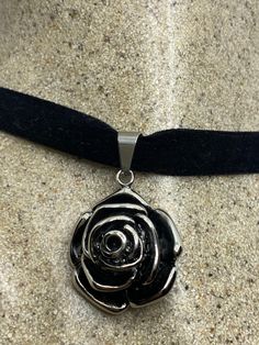 Vintage silver stainless steel gothic pendant rose flower amulet for protection. Over an inch Hangs on a velvet ribbon. Fits on a thick chain All jewelry is shipped in a nice gift box. Check out our over a THOUSAND great reviews Gothic Rose Jewelry For Gift, Gothic Rose Colored Jewelry For Gift, Gothic Rose-colored Jewelry For Gifts, Rose-colored Gothic Jewelry For Gift, Black Necklace With Rose Design As Gift, Black Necklace With Rose Design For Gift, Gothic Necklaces, Rose Choker, Gothic Pendant