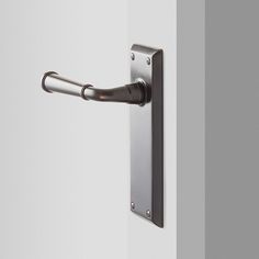 an open door with a handle on it and a button in the middle that is pointing to something