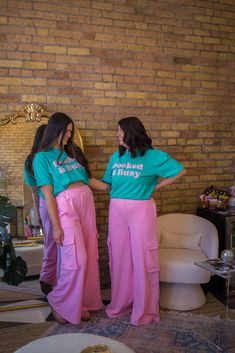 These Bubblegum Pink Cargo Sweatpants feature a wide leg design and french terry material for ultimate comfort. The added cargo pocket adds extra style. Perfect for lounging or running errands, these sweatpants are a must-have for anyone. -Cargo pockets -Elastic waist band -Oversized fit -Wide leg Cargo Sweatpants, Cargo Pocket, Top Graphic Tees, Cardigan Vest, Leg Design, Bubblegum Pink, Dress Romper, Hat Hairstyles, Waist Band