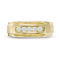 a yellow gold ring with five diamonds