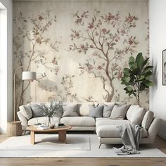 a living room with a couch, coffee table and wall mural