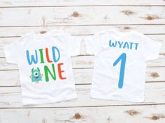 two birthday shirts with the number four on them, one is white and the other is blue