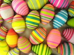 colorful striped easter eggs in a bowl