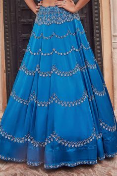 Prussian blue satin organza lehenga with an attached cancan and glass pipes, sequins and beaded hand embroidery. Comes with a padded blouse with an attached organza jacket. - Aza Fashions Blue Georgette Evening Choli, Evening Blue Georgette Choli, Blue Festive Evening Choli, Festive Blue Evening Choli, Blue Georgette Evening Sets, Blue Organza Party Wear Choli, Blue Sharara For Evening Eid, Blue Embellished Party Wear Sets, Blue Party Wear Sets For Evening