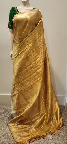 Beautiful Kanchi Silk in Gold Saree W/ Custom Blouse. For Custom Blouse Pls contact us. Free Shipping within the US. Saree ships immediately within the US and the Blouse 2 weeks later. Custom blouse stitching $35. Work blouse available for $99, which shown in the picture. Blouse For Golden Saree, Gold Saree Contrast Blouse, Formal Tussar Silk Pre-draped Saree, Transitional Gold Cotton Silk Blouse Piece, Gold Colour Saree Contrast Blouse, Gold Tissue Silk Blouse With Dupatta, Tissue Silk Blouse For Wedding, Gold Cotton Silk Blouse With Dupatta, Elegant Cotton Silk Blouse For Traditional Occasions