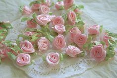 small pink roses on a lace doily