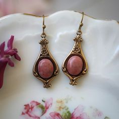 Rhodonite Stone in Brass Setting Jewelry Collection - Etsy Vintage Teardrop Natural Stones Jewelry, Bronze Gemstone Brass Jewelry, Bronze Brass Jewelry With Gemstone, Vintage Natural Stone Earrings For Gift, Vintage Earrings With Natural Stones For Gift, Bronze Antique Finish Drop Earrings, Ornate Nickel-free Bronze Jewelry, Bronze Ornate Nickel-free Jewelry, Vintage Teardrop Natural Stone Earrings