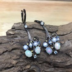 Handcrafted in 925 sterling silver Black rhodium plated Swiss Blue topaz white baroque pearls opal 60x19mm Weight 10 grams Fire Opal Earrings, Drop Earrings Silver, Colored Stones, Women Earrings, Pearl Earrings Dangle, Earrings Minimalist, Opal Earrings, Black Rhodium, Fashion Jewelry Earrings