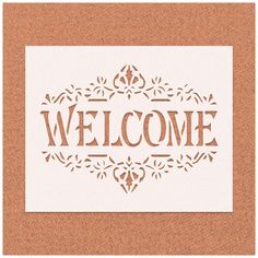 the word welcome is cut out from paper and placed on top of a cork board