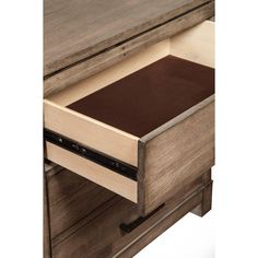 the drawer is open and has a brown cloth on it's bottom shelf,