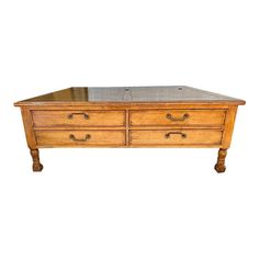 an old wooden coffee table with two drawers on one side and a mirror top on the other