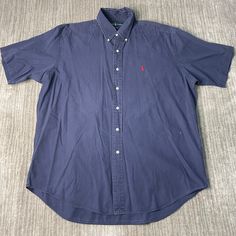 Vintage 90s Polo Ralph Lauren Small Pony Stitched Embroidered Logo Casual Formal Dress Essential Navy Button Up Collar Shirt Large Mens  Condition:  Excellent Used Condition  = No Flaws Measurements: Please see photos above for all measurements IF YOU BUY TWO OR MORE ITEMS USE THE CODE BUNDLE @ CHECK TO SAVE 20% WE SHIP WITHIN 24 HOURS AFTER PURCHASE! Please be aware that we do not offer free returns!! The Buyer is responsible for the cost of the return label. Follow us on TikTok & Instagram @findsnostalgic and tag us in your finds Classic Embroidered Button-up Shirt, Classic Embroidered Short Sleeve Shirt, Casual Formal Dress, Casual Formal Dresses, Mens Oxfords, Collar Shirt, Collar Shirts, Formal Dress, Polo Ralph