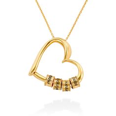 Treat your mom to something special, a piece that is meaningful and 100% customized. The Charming Necklace with Engraved Beads in Gold Plating features 5 personalized beads and a small space on the pendant for personalization. This mothers necklace with childrens names is so sophisticated that you can wear it for every occasion. Fashioned from 18k gold plating on sterling silverElegant heart pendant with up to 5 beadsCustomizable with 1 to 5 namesYour mom will adore this becauseThe sleek and ... Engraved Heart Necklace, Family Jewellery, Mothers Necklace, Handmade Jewelry Gift, Hanging Hearts, Mom Necklace, Gifts For Your Mom, Beautiful Heart, Personalized Necklace