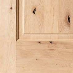 a close up view of the wood grains on an unfinished cabinet door