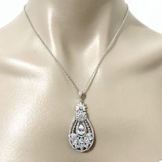 "A glamorous celebrity boho wedding vintage style bridal necklace with ornate details made of sparkly clear cubic zirconia in tarnish-resistant white gold silver rhodium finish. Pendant is just over 2\" (5cm). Chain length can be added with a 2\" extender chain. See matching pieces & design variations at https://etsy.me/2fL2sud View all jewelry sets at https://etsy.me/1dRzLEZ" Boho Wedding Jewelry, Wedding Fans, Wedding Vintage, Cz Pendant, Wedding Jewelry Sets, Bridal Necklace, Wedding Necklace, Bridal Earrings, Chain Length