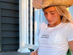 Cool it, cowboy! This Cool It Cowboy Crop Top is perfect for your favorite coastal cowgirl. Let's go girls, let's show off our western style. The perfect mix of sass and class will make you a heartthrob at every rodeo. * 52% combed ring-spun cotton, 48% polyester * Slim fit * Side-seamed construction White Tops For Country Events In Summer, Casual White Tops For Country Events, Cowboy Y2k, Cool It Cowboy, Tailgate Clothes, Cowboy Baby, Southern Women, Baby Crop Top, Graphic Crop Top