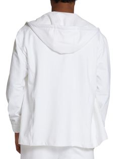 This white long-sleeved zip-up hoodie comes in cotton, a fabric that has been taken from our shirting fabric archive. This iconic sporty-chic garment was created from a need to offer the Kiton man a comfortable and laid-back wardrobe that travels well, folded in his suitcase and not in garment bags. This garment has two patch pockets on the front, stretch inner cuffs, and a straight hem without slits. The hood features an adjustable herringbone cotton drawstring with the Kiton logo laser-etchedon an aglet. This sweatshirt style features a tone-on-tone inner placket and underarm panel. Regular fit. Quality, simplicity and exclusivity: this garment requires six hours of craftsmanship and 22 artisanal steps all performed at our Naples workshop. To keep your Kiton hoodie looking flawless, we r White Cotton Hooded Jacket For Fall, Oversized White Outerwear With Drawstring Hood, Oversized White Cotton Hooded Jacket, Casual White Cotton Hooded Jacket, Sporty Cotton Hooded Jacket For Loungewear, Cotton Hooded Jacket For Loungewear In Athleisure Style, Cotton Athleisure Hooded Jacket For Loungewear, White Cotton Hooded Jacket, Modern Cotton Sweatshirt For Spring