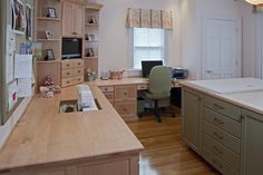 a kitchen with an island and desk in it