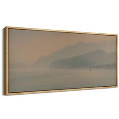 a painting hanging on the wall with water and mountains in the background