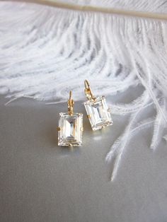 "These elegant sparkly little earrings are made with fine Swarovski crystals in fancy step cut rectangle shape. Available in gold, rose gold or silver finish. Timeless understated elegance perfect for any occasion. Matching necklace and bracelet is also available. - Measurements: 7/8\" long from the top of the ear wire to the bottom of the earring and 3/8\" wide" Rose Gold Wedding Earrings, Gold Wedding Earrings, Long Bridal Earrings, Crystal Bridal Earrings, Bridal Earrings Drop, Gold Bridal Earrings, Pearl Jewelry Wedding, Jewelry Accessories Ideas, Step Cut