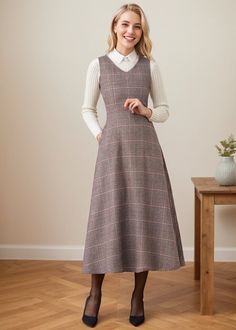 ★★FEATURES 25% wool, other fiber, nylon Two side pockets Back zipper closure Sleeveless dress Plaid dress Midi length Perfect for winter, autumn, spring Dry clean ★★ The model is 170 cm (5′ 7″) tall with a 80 cm (31.5") bust, 66 cm (26") waist. She is wearing in size XS. ★★Bespoke Order Service If you Request other color Request the length Your height is not between 155 cm- 175 cm Your weight is not between 47 kg -77 kg I can do it for you, It will need some extra fee depending on on your need. Contact with me for more detail. ★★ Warmly Note: 1 ) : Please confirm your shipping address! If you wish to ship the item to a different address, please send me a message immediately after purchase. We can't change it after shipping, thank you for your understanding. 2 ) : Due to individual monitor Winter Wool Tweed Dress Knee-length, Knee-length Wool Tweed Dress For Winter, Winter Wool Tweed Knee-length Dress, V-neck Wool Dress For Fall, Wool V-neck Dress For Fall, Sleeveless Midi Dress For Workwear In Fall, Fall Midi Length Sleeveless Dress For Work, Fall Wool V-neck Dress, Sleeveless Wool Dress For Fall