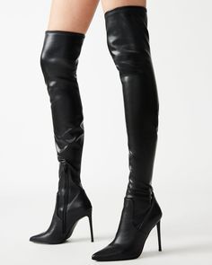 VAVA-voom! A towering stiletto heel, pointed toe and thigh-high shaft make this boot one of the season’s sexiest. Stretch upper to fit most leg sizes Reinforced on top with a silicon strap to ensure no slouching Zipper for ease of getting on and off 4-way stretch patent 4 inch heel height Size 6 measurements: 16.5 inch shaft top circumference, 23.5 inch shaft height Size 8 measurements: 17.25 inch shaft top circumference, 24.5 inch shaft height Size 10 measurements: 18 inch shaft top circumferen Stiletto Heel Boots, High Black Boots, Black Paris, Black Thigh High Boots, Christian Louboutin Boots, Black Stiletto Heels, Steve Madden Store, Thigh Boots, Mob Wife