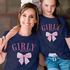 Unleash your girly side with the Girly Mama & Mini Tees. Featuring adorable bows and perfect for matching with your mini me, these tees are made for the ultimate girly duo. Perfect for moms and daughters who love to have fun and look cute! Design is Printed Direct to Garment. Fun Pink Tops For Family Occasions, Cute Pink Tops For Family Occasions, Cute Blue Tops For Family Occasions, Playful Pink Tops For Mother's Day, Playful Pink T-shirt For Gender Reveal, Pink Matching Top For Gender Reveal, Cute Pink T-shirt For Mother's Day, Pink Family Matching Tops For Gender Reveal, Family Matching Pink Tops For Gender Reveal