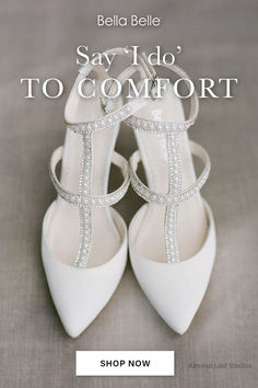 a pair of white high heeled shoes with bows on the side and words say say i'd do to comfort