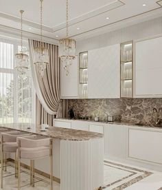 an elegant kitchen with marble counter tops and white cabinets, along with chandelier hanging from the ceiling