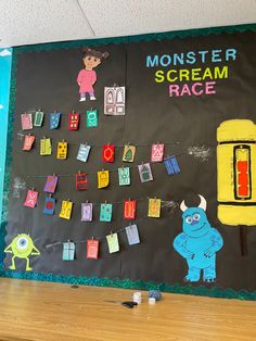 a bulletin board with monsters on it in the middle of a school classroom room decorated for halloween