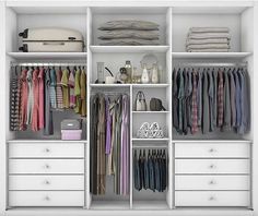 an open closet with clothes and other items