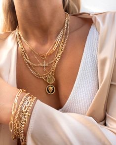 This layering piece catches the light and adds the right amount of length and sparkle to your neck. We love her paired with the Link Up Necklace, Nile Necklace, and Harper Chain Necklace. 14k Gold Fill Cross + Coin Pendants Length: 19"