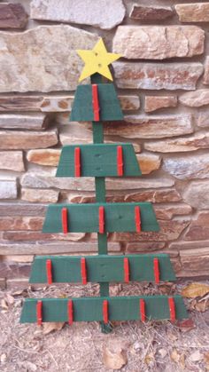 "\"Oh Christmas tree, oh Christmas tree, I need to purchase thee!\" This adorable Christmas tree has been constructed with recycled hand painted pallet wood. It features clothespins to hang holiday cards/pictures and has a cute star to top it all off. This unique item will make your guests feel jealous of your amazing and practical decorating skills. You may just need to purchase another for your mom, sister, bestie, etc." Holiday Card Pictures, Painted Pallet, Pallet Tree, Christmas Tree Card, Pallet Christmas Tree, Oh Christmas Tree, Pallet Christmas, Wood Wedding Signs, Cute Star