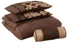 three pillows are stacked on top of each other with brown and white designs in them