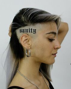 a woman with the word vanity written on her forehead