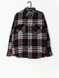 Vintage plaid flannel shirt in black, red and white. This shirt features two chest pockets, long sleeves and an extremely soft fleece-style material to keep you warm and toasty this winter! Made from a lovely lightweight soft fabric.  Our recommended size: Large  Label says: Large  Condition: Very good  Material: No care label, feels like a synthetic material  Measurements in inches, laid flat: Pit to pit: 24 Shoulders: 19.5 Front length: 29.5 Back length: 29.5 Sleeve length:24.5 We recommend th Winter Plaid Long Sleeve Shirt, Black Long Sleeve Flannel Shirt For Fall, Winter Long Sleeve Flannel Shirt, Black Flannel Shirt With Pockets For Winter, Black Winter Flannel Shirt With Pockets, Red Flannel Shirt For Winter, Red Winter Flannel Shirt With Pockets, Winter Long Sleeve Flannel Shirt With Relaxed Fit, Plaid Flannel Shirt With Pockets