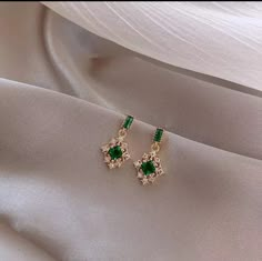 Our beautiful Gold & green drop earrings would make beautiful wedding or prom earrings The length of the drop is 1.8cm The width of the drop is 1cm Check out our full emerald jewellery sets  Check out our mix and match any 4 items of your choice for £30!  In every listing there is a mix and match photo with a number unique to that item, when purchasing the mix and match listing please quote the 4 unique item numbers so I know which items you would like sending.  If the listing has different colo Emerald Earrings Drop, Feminine Jewelry, Emerald Green Earrings, Prom Earrings, Prom Jewelry, Green Jewelry, Green Crystal, Emerald Earrings, Green Earrings