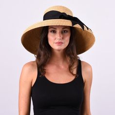 Wauwinet, Large brim. The Wauwinet hat is the epitome of New England elegance. Featuring a tall crown and a downturned brim, this dramatic hat is sure to turn heads. Natural Toquilla Straw Hat With High Crown, High Crown Straw Hat For Summer Vacation, Natural High Crown Toquilla Straw Hat, Summer High Crown Boater Hat For Beach, Summer Beach Boater Hat With High Crown, Summer Vacation High Crown Straw Hat, Natural High Crown Straw Hat For Beach, Natural High Crown Straw Hat For Vacation, Adjustable High Crown Sun Hat For Vacation