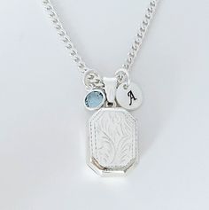 "Solid Sterling silver Locket Rectangle Necklace-  This piece will be a treasured keepsake! They're not only a trendy, stylish accessory, but also boast a rich and fascinating history.  This locket has a little bit of rim on both sides to hold two pictures in place without any glue!  The chains and Lockets I offer are solid 925 Sterling Silver Italy made, not silver or gold plated. . Take a look at other Locket designs: http://etsy.me/XKqYt8 . DESCRIPTION:  . Solid 925 Sterling silver Locket size:  20 mm L x 15 mm. . Sterling Silver disc 8mm with your chosen initial or heart 7mm upon request. . Swarovski birthstone of your choice month. . 925 Sterling Silver Italian Chains. I recommend curb chain for lockets!!   Need initials, charms, etc,? this link: http://etsy.me/UFmfXa . LOCKETS BY SHA Cheap Adjustable Silver Locket Necklace, White Gold Rectangular Pendant For Wedding, Sterling Silver Rectangular Pendant Jewelry Gift, White Gold Vintage Charm Pendant Jewelry, Vintage White Gold Pendant Jewelry, Sterling Silver Etched Rectangular Pendant Jewelry, Etched Sterling Silver Rectangular Pendant Jewelry, Elegant Charm Necklace With Rectangular Pendant For Anniversary, Silver Etched Square Pendant Necklace