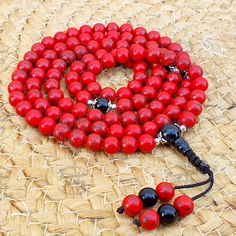 📿This Buddhist Mala is handcrafted with Red Howlite Beads and Black Agete Guru Bead. It encourages emotional expression and strengthens learning abilities. It promotes patience, tolerance, clear communication, and proper expression of unprocessed emotions. They help develop a connection with the higher self. It brings peace, harmony, insight, and spiritual alignment. This Statement Jewelry encourages a better understanding of self and heightens awareness.📿 ✨ MALA DETAILS ✨ 🧧8MM Round Red Howl Traditional Red Bracelets For Meditation, Red 8mm Beads Jewelry For Meditation, Bohemian Red Bracelet With 108 Beads, Red Healing Bracelet With 108 Beads, Red 8mm Beads Healing Jewelry, Red 8mm Beads Jewelry For Healing, Red Gemstone Beaded Bracelets, Red Spiritual Beaded Bracelets For Meditation, Red Spiritual Bracelets With 108 Beads