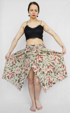 "Lovely handmade vintage wrap skirt; there are no holes for the belt as you would expect from wrap skirt that has been made nowadays. In perfect vintage condition, will be great for summer, festivals or beach. The best will fit for S -M sizes. Measurements: Waist (full width): 35\" (89 cm) Hips: free Length: 29\" (73 cm) Model in the photos is size S More from Vintage Finds: https://www.etsy.com/shop/somethingmustbehere We also make linen, knit and crochet items: https://www.etsy.com/shop/ActLikeACharm" Spring Beach Wrap Skirt Asymmetrical, Spring Beach Wrap Maxi Skirt, Spring Floral Print Long Wrap Skirt, Summer Asymmetrical Wrap Skirt With Floral Print, Summer Midi Wrap Skirt, Relaxed Fit Midi Wrap Skirt For Summer, Beige Wrap Skirt For Summer Beach, Bohemian Cotton Wrap Skirt For Summer, Cotton Wrap Skirt For The Beach