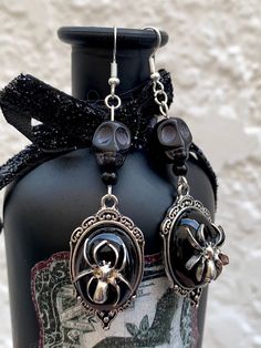 "A pair of earrings Morticia Addams would be proud of! 🕷️ \"Normal is an illusion. What is normal for the spider is chaos for the fly\" -Morticia Addams These silver gothic style earrings have a silver antique frame with a black background and spider in the center. There is a black stone skull at the top for an added touch of mortality. These earrings are on the heavier side but are still an easy wear on the ears. Charms measure and 2 5/8 inches  Hooks are hypoallergenic These are timeless and would be a beautiful addition to any outfit beyond spooky season 🥀🪦" Black Morticia Addams, Normal Is An Illusion, Gothic Spider, What Is Normal, Gomez And Morticia, Dark Coquette, Spider Jewelry, Morticia Addams, Antique Frame