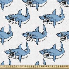 a blue and white shark print fabric with teeth on the front, it's mouth open