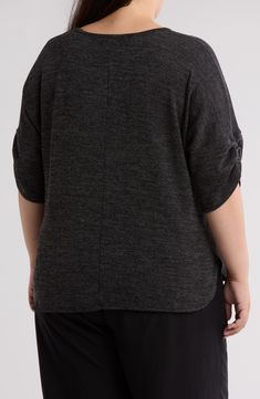 Gentle gathering defines the dolman sleeves of a lightweight ribbed sweater that's ideal for transitioning your wardrobe into cooler seasons. 27" length Crewneck Three-quarter sleeves 88% polyester, 9% viscose, 3% spandex Machine wash, dry flat Imported Black Tops With Ribbed Cuffs, Oversized Textured Knit Tops For Work, Knit Batwing Sleeve Tops In Solid Color, Solid Color Knit Tops With Batwing Sleeves, Gray Stretch Textured Knit Tops, Batwing Sleeve Tops With Ribbed Cuffs For Layering, Layering Tops With Ribbed Cuffs And Batwing Sleeves, Oversized Gray Ribbed Top, Oversized Ribbed Batwing Sleeve Top