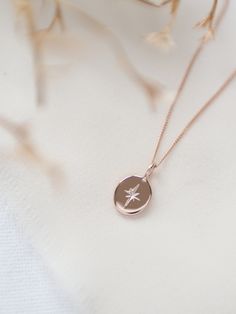 "Capturing the beauty of the night sky, this necklace features a dainty hand engraved solid 9 carat rose gold oval pendant suspended on a delicate solid gold curb chain. Perfect for layering up, or it can be worn alone for a minimalist look.  MADE FROM: + solid 9 carat rose gold (fully hallmarked) + also available in other gold colours (see listings) DIMENSIONS:  + the oval pendant measures approximately 9mm x 5mm + choose from a short (16\") or medium (18\") length chain Made especially for you, your necklace will come in a branded gift box, ready for gift giving. If purchasing as a gift, I can send it straight to the recipient with a hand written note. This necklace is handmade to order by me, and not by a machine. If you require delivery sooner than the advertised estimate, please conta Simple Gold Pendant, Star Wedding Band, Hand Engraved Rings, Gold Star Necklace, Initial Charm Bracelet, Gold Curb Chain, North Star Necklace, Karma Necklace, Star Necklace Silver