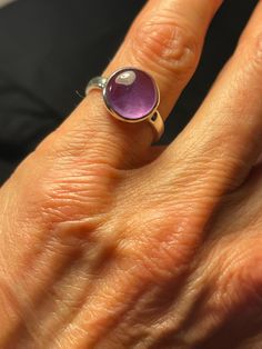 Round Cabochon Amethyst Ring, Hand cast in Sterling Silver. Sterling Silver high bezel, Purple Amethyst, February Birthstone Size 5.5 US flower motif...one of my favorite castings, only a few ever made Item#214 Purple Amethyst Oval Cabochon Ring, Classic Amethyst Birthstone, Classic Amethyst Oval Cabochon Ring, Classic Amethyst Jewelry With Bezel Setting, Classic Round Amethyst Birthstone Ring, Round Gemstones With Stone Setting Gift, Classic Purple Cabochon Rings, Purple Oval Cabochon Ring, Round Cut Amethyst Gemstones With Accent Stones