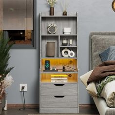 a bed room with a neatly made bed and a book shelf next to the bed