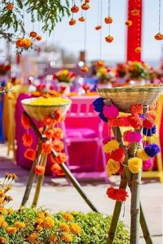 an outdoor event decorated with flowers and decorations